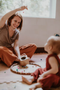 mom playing with baby