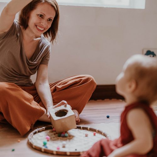 mom playing with baby